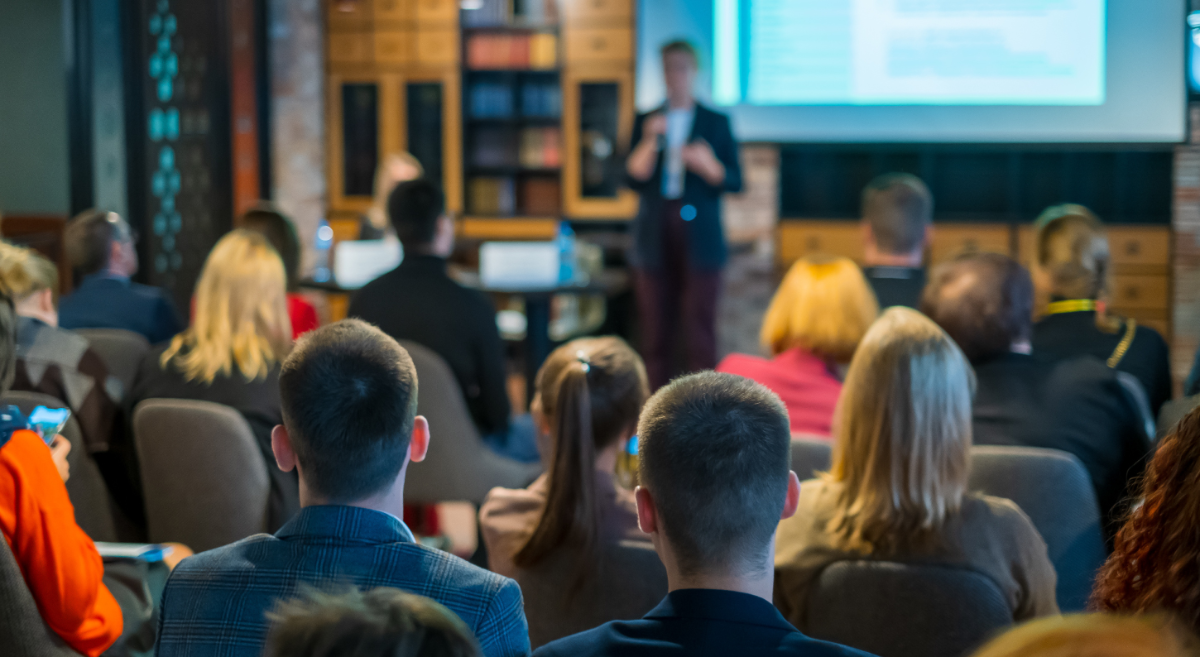 A group of people listening to a seminar